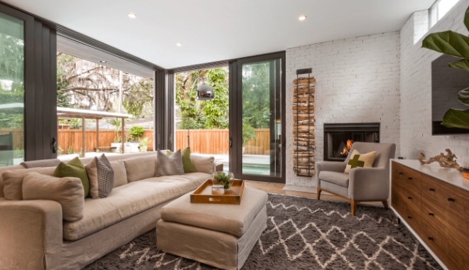 Open plan Florida living room with sliding glass doors to a screened lanai